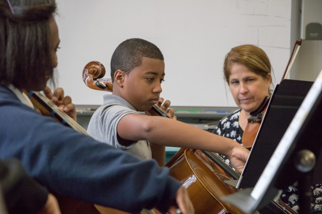 Gian Mercado (middle) comes to the orchestra room to practice during lunch break. (Photo by Timmy H.M. Shen)